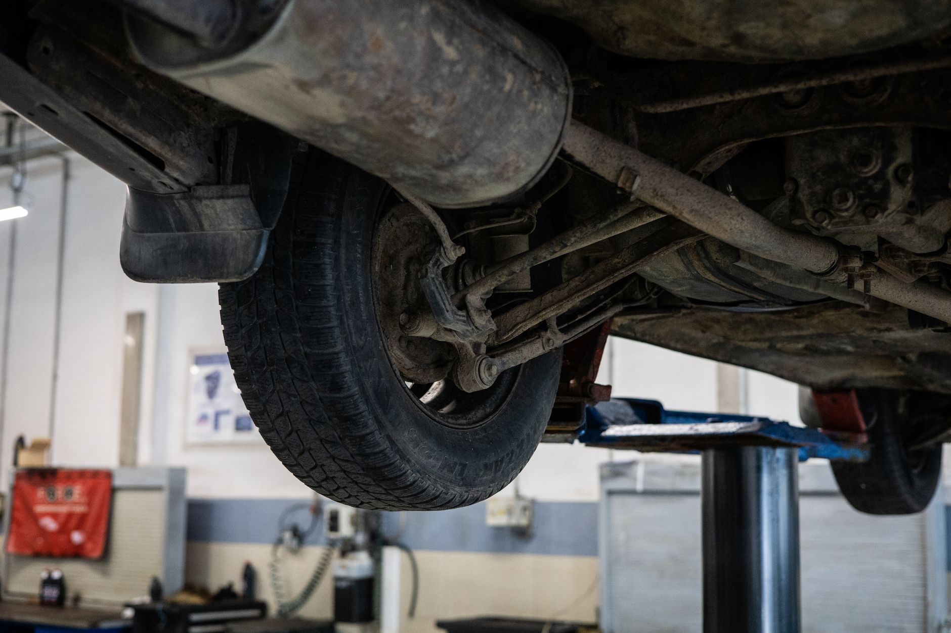 Mechanic checking a car tyre